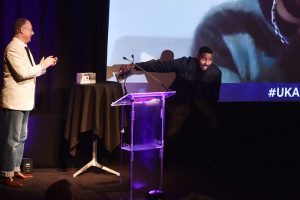 Award 25b - Jordan & Perri on stage winning moment