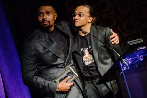 Award 25c - Jordan & Perri with trophy on stage