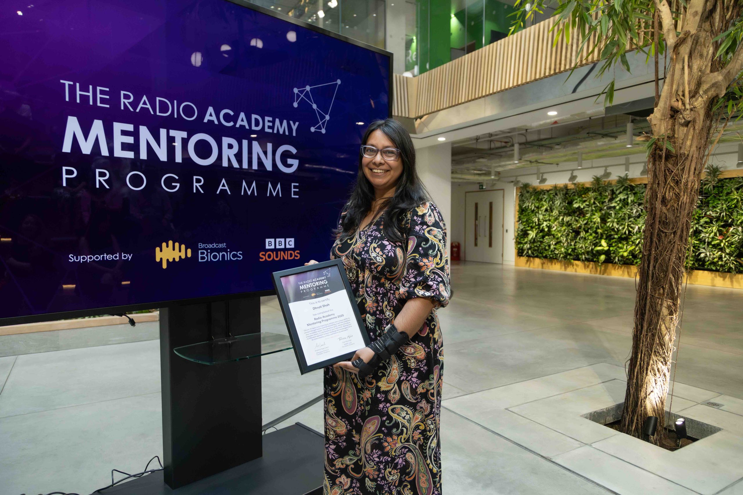 Dhruti Shah receiving her certificate on graduation day. Photo by Tricia Yourkevich